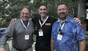 James McGovern (centre) of Candoo Property Services with delegates at the International Franchise Expo in New York. Image: FranchiseReady.com.au